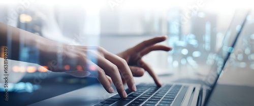 Hands at Work: Focused and illuminated hands poised over a modern laptop keyboard, navigating through a complex network of data with precision and dedication.