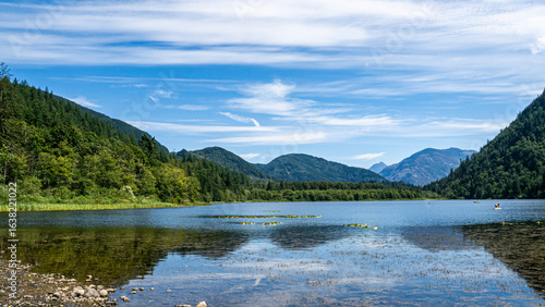 Fototapeta Naklejka Na Ścianę i Meble -  Hick lake in Sasquatch provincial park showcasing its calm waters, wooded shoreline, and campground surroundings, Harrison, BC, Canada