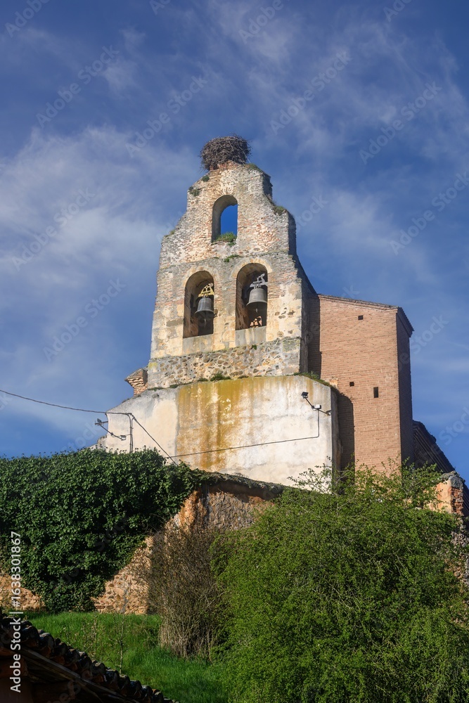Fototapeta premium Church of San Justo y San Pastor in Acera de la Vega with bell gable, Palencia