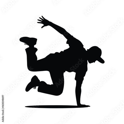 Breakdancer in dynamic pose captured in silhouette