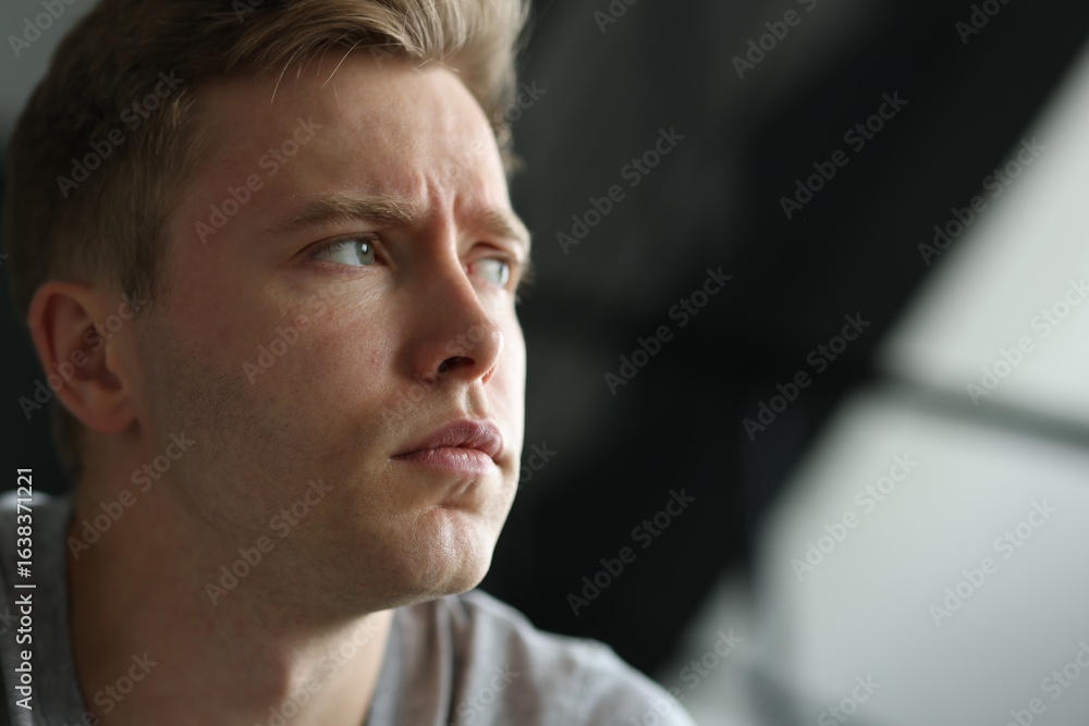 Fototapeta premium Sad man on blurred background, space for text. Depression