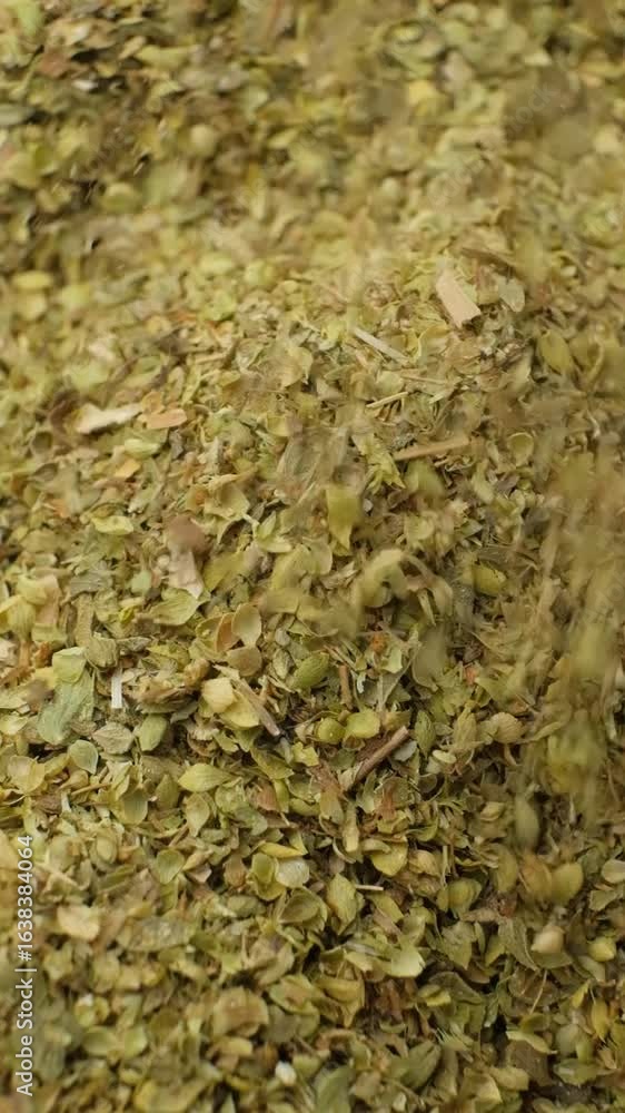 Oregano Natural Spice Pours On Pile Macro Slow Motion Vertical Oregano Natural Spice Pours On Pile Macro Slow Motion Vertical