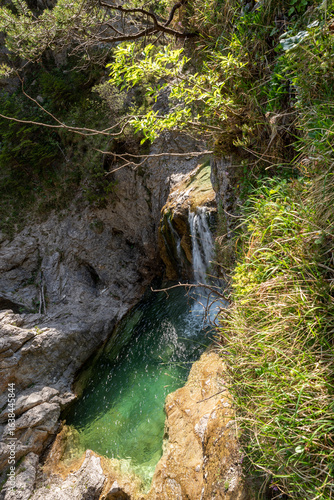 View over the small Stuiben Falls on a sunny day, reutte, Austria. Small waterfalls in beautiful nature.