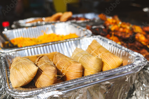 Cuadro en lienzo Homemade Corn and Chicken Tamales at a street vendor