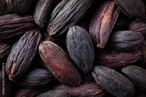 Aerial Close-Up of Tonka Beans Isolated, Highlighting Their Unique Texture and Color for Culinary and Aromatic Uses in Natural Health and Wellness Contexts.