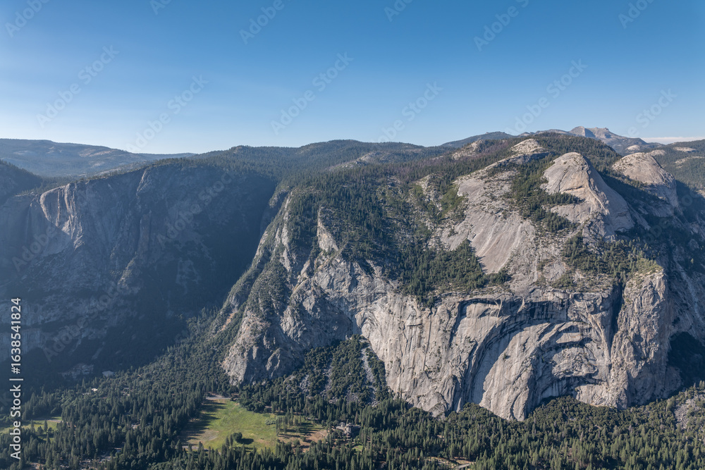 North Dome is Half Dome Granodiorite (Cretaceous). Glacier Point, Yosemite National Park, California. Sierra Nevada. Erosion and weathering. Yosemite Valley is a glacial valley.
North Dome is Half Dome Granodiorite (Cretaceous). Glacier Point, Yosemite National Park, California. Sierra Nevada. Erosion and weathering. Yosemite Valley is a glacial valley.