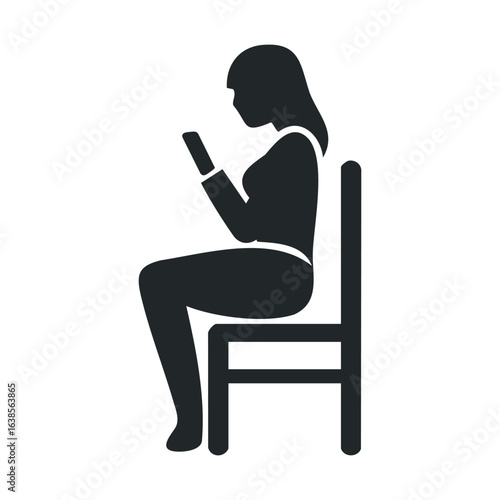 Silhouette of woman sitting on chair using smartphone