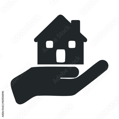 Hand holding house icon - symbol of real estate and homeownership