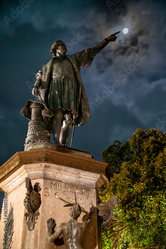 statue of Christopher Columbus touching the moon at night in the colonial sguare in the colonial district, santo domingo, dominican republic 