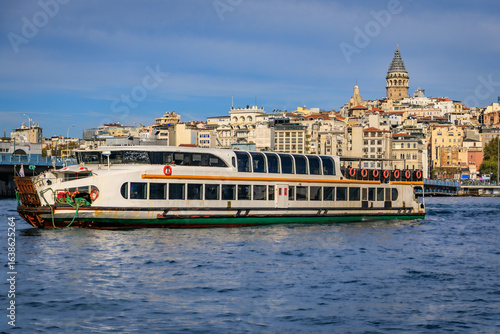 Canvas Print Bosphorus Strait with a ferry near Galata Bridge in Istanbul, Turkey