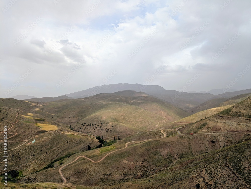 Obraz premium Mountainous landscape with winding roads in the Atlas Mountains