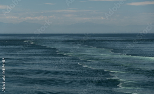 Wake in Moresby passage behind ferry heading to Swartz Bay