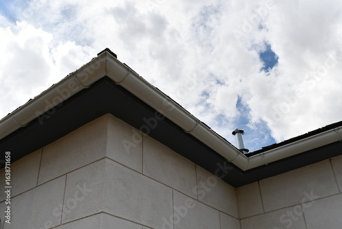 Gutters on old stone block building.