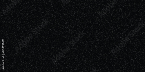 Dark textured surface black granular design with small speckled elements and subtle grain effect ideal for digital wallpapers or graphic design.