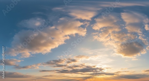 A panoramic view of a vibrant sunset sky filled with fluffy clouds.