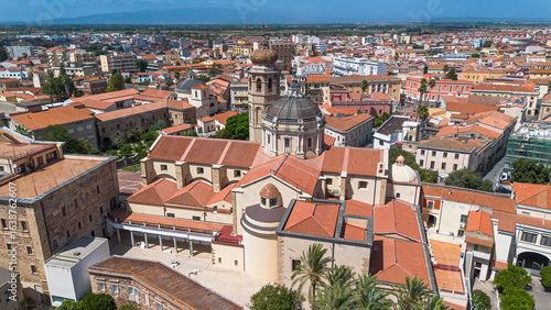 Aerial view of the Oristano Cathedral in Sardinia, Italy - Baroque cathedral dedicated to the Assumption of the Virgin Mary with a bell tower topped by an onion dome covered with maiolica