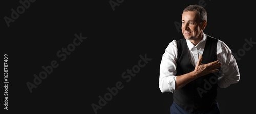 Εκτύπωση καμβά Mature actor on dark background with space for text