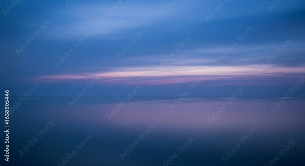 Obraz premium Tranquil Seascape at Dusk with Soft Blue and Purple Hues Reflecting on the Water Surface a Moment of Peace