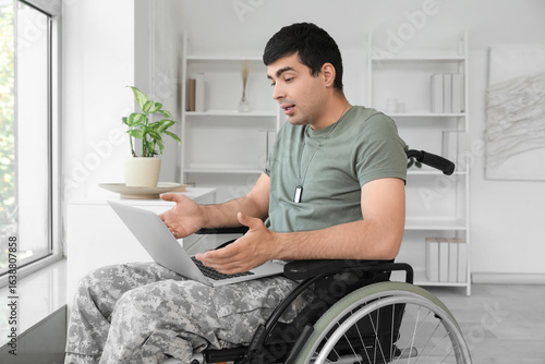 Young soldier in wheelchair...