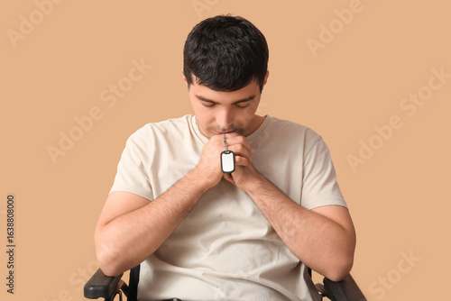 Sad young soldier in wheelc...