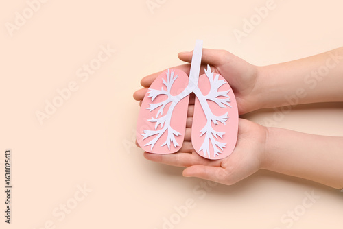 Female hands with paper lun...
