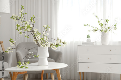 Vase with blooming branches...