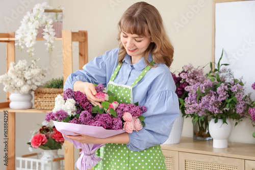 Female florist with beautif...