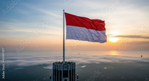 National flag waving in sunrise over city