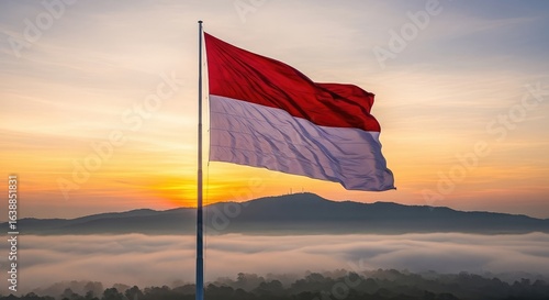 National flag waving in sunrise over hills