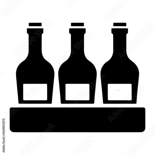 Three black bottles in a holder container