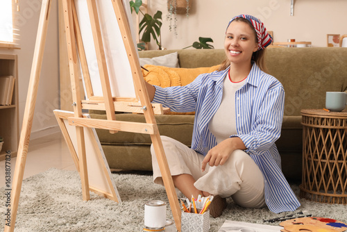 Young female artist sitting...