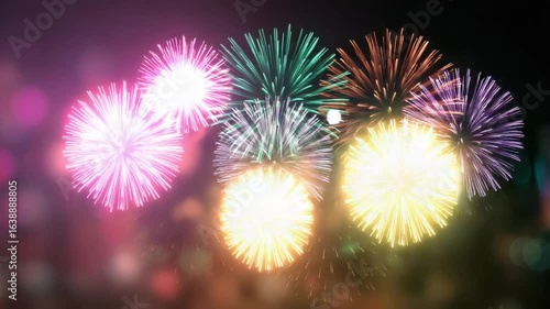 Explosive Color in the Night Sky: Witness a mesmerizing display of brilliant fireworks bursting in the dark expanse, painting vibrant patterns in the air, perfect for celebrating joyous occasions.