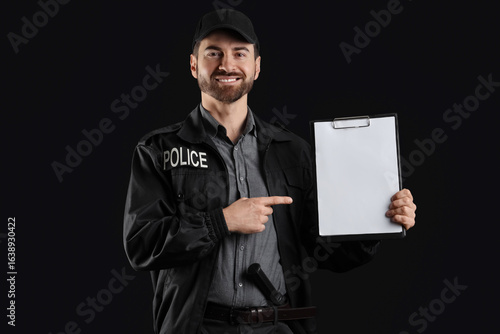 Happy male police officer p...