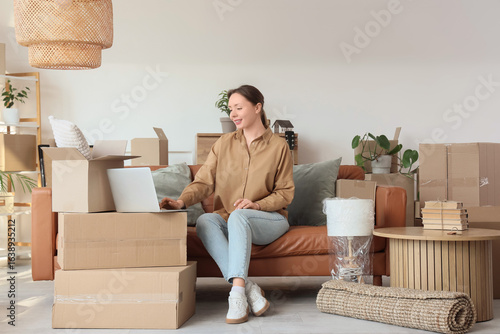 Young woman using laptop on...