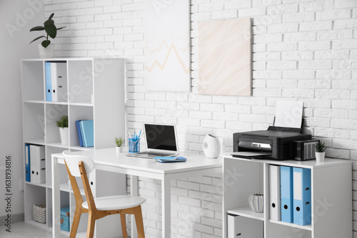 Stylish workplace with mode...