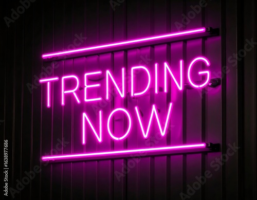 Vibrant pink neon sign on a dark wall, displaying 