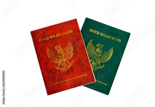 A pair of buku nikah (marriage certificates) for a suami (husband) and istri (wife) isolated on a white background. These are legal documents proving the validity of marriage in Indonesia.
