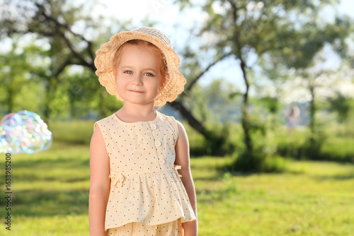 Cute little girl with hat a...