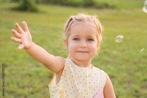 Cute little girl with soap ...