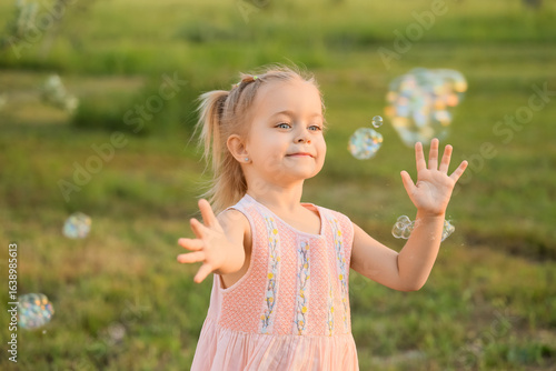 Cute little girl with soap ...