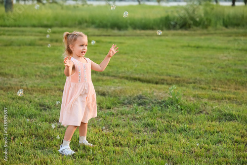 Cute little girl with soap ...