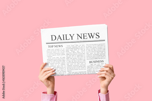 Female hands with newspaper...