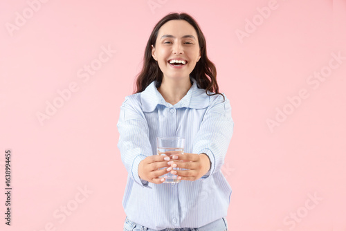Young woman with glass of w...