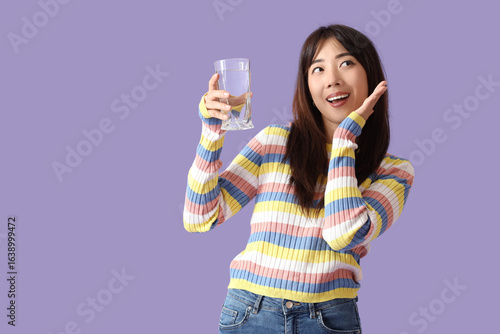 Happy young Asian woman wit...