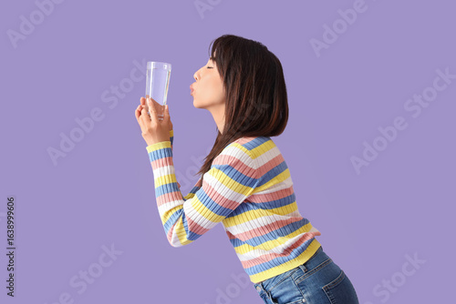 Young Asian woman with glas...