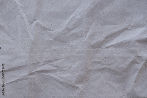 Brown crumpled recycled paper texture background. Kraft Paper