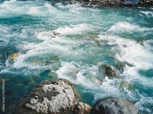 Close-up of a seething mountain river. Beautiful natural background.