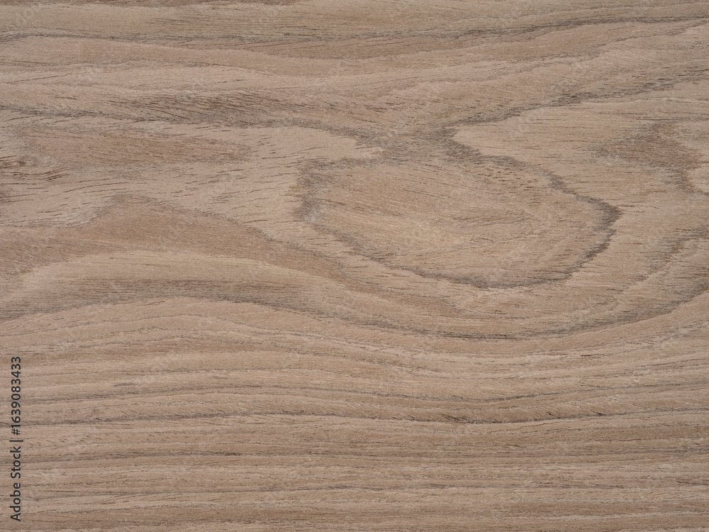 Naklejka premium Natural wood veneer texture showcasing rich swirls and organic grain patterns