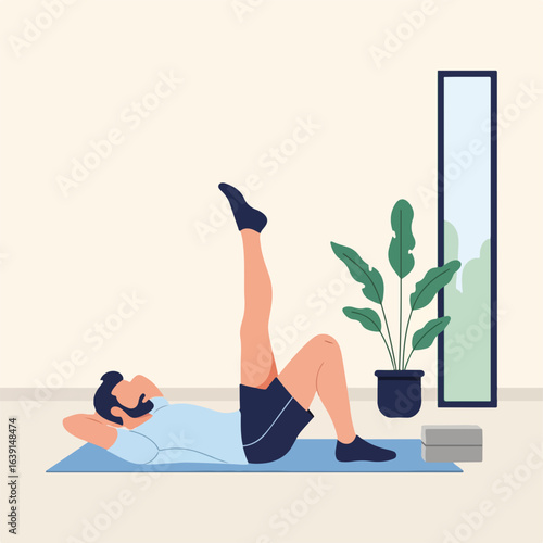 Engaging in fitness at home, man executes leg raises on yoga mat in sunlit room. Fitness at home routine ensures body strength and flexibility.