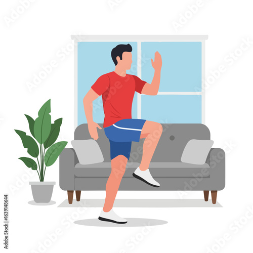 Man practices fitness at home by lifting his knee and moving his arms for an at home fitness routine.